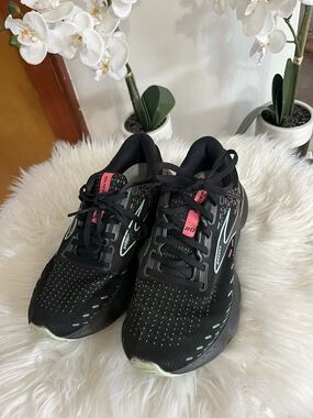 Brooks Black Running Shoes with Mint and Pink Accents Small detail visible in th